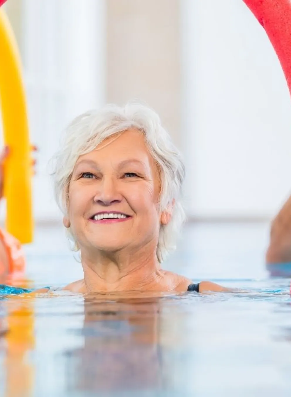 Older woman in water exercising