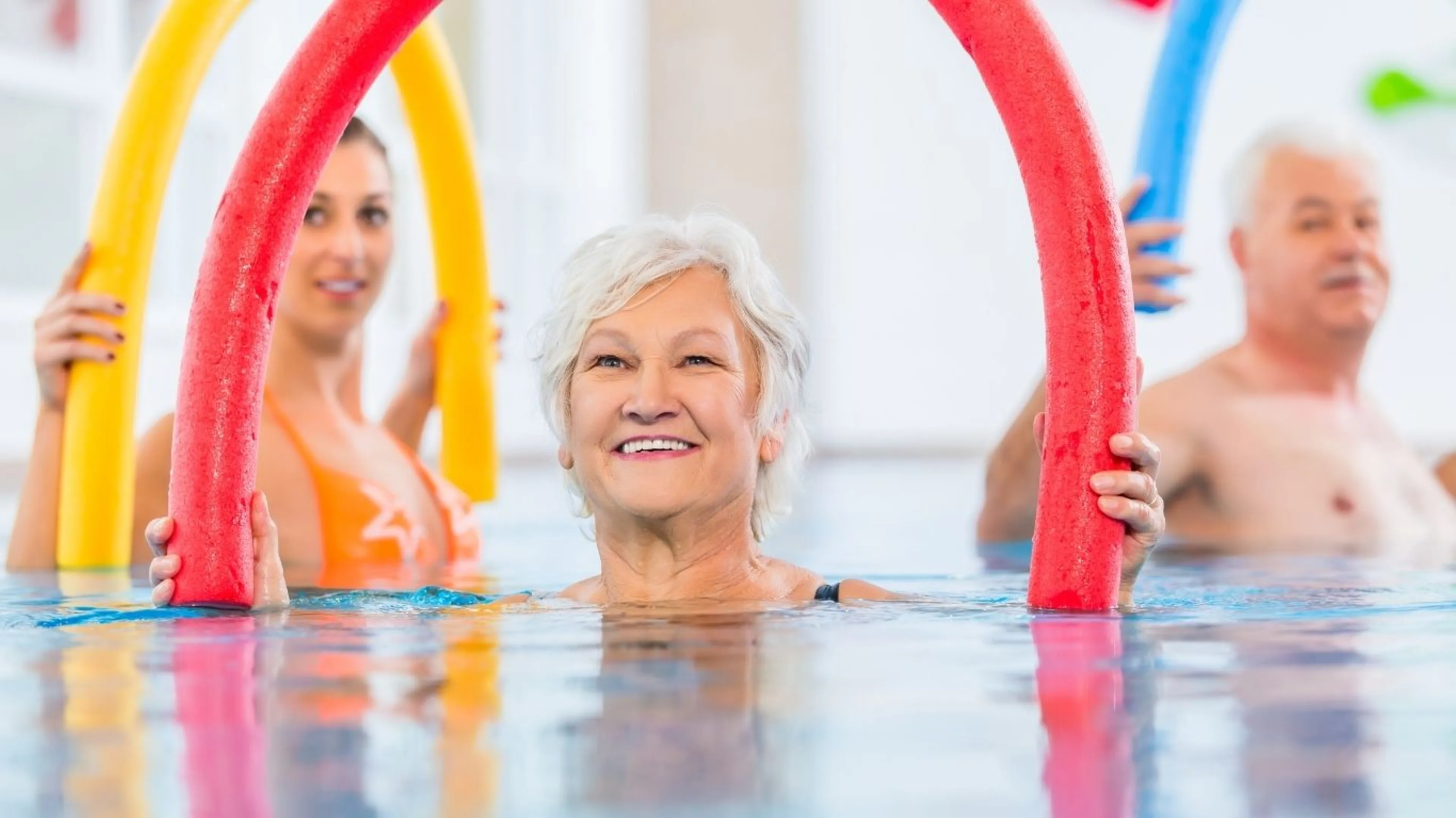 Older woman in water exercising